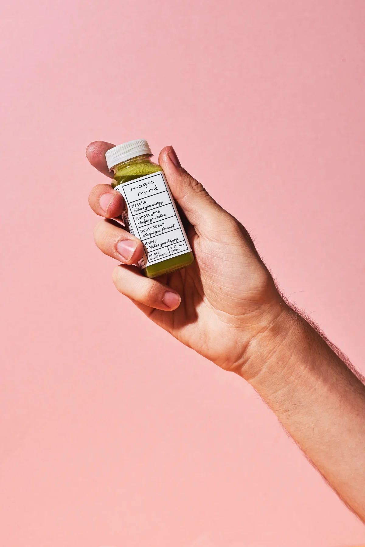 Hand holding a bottle with a custom label