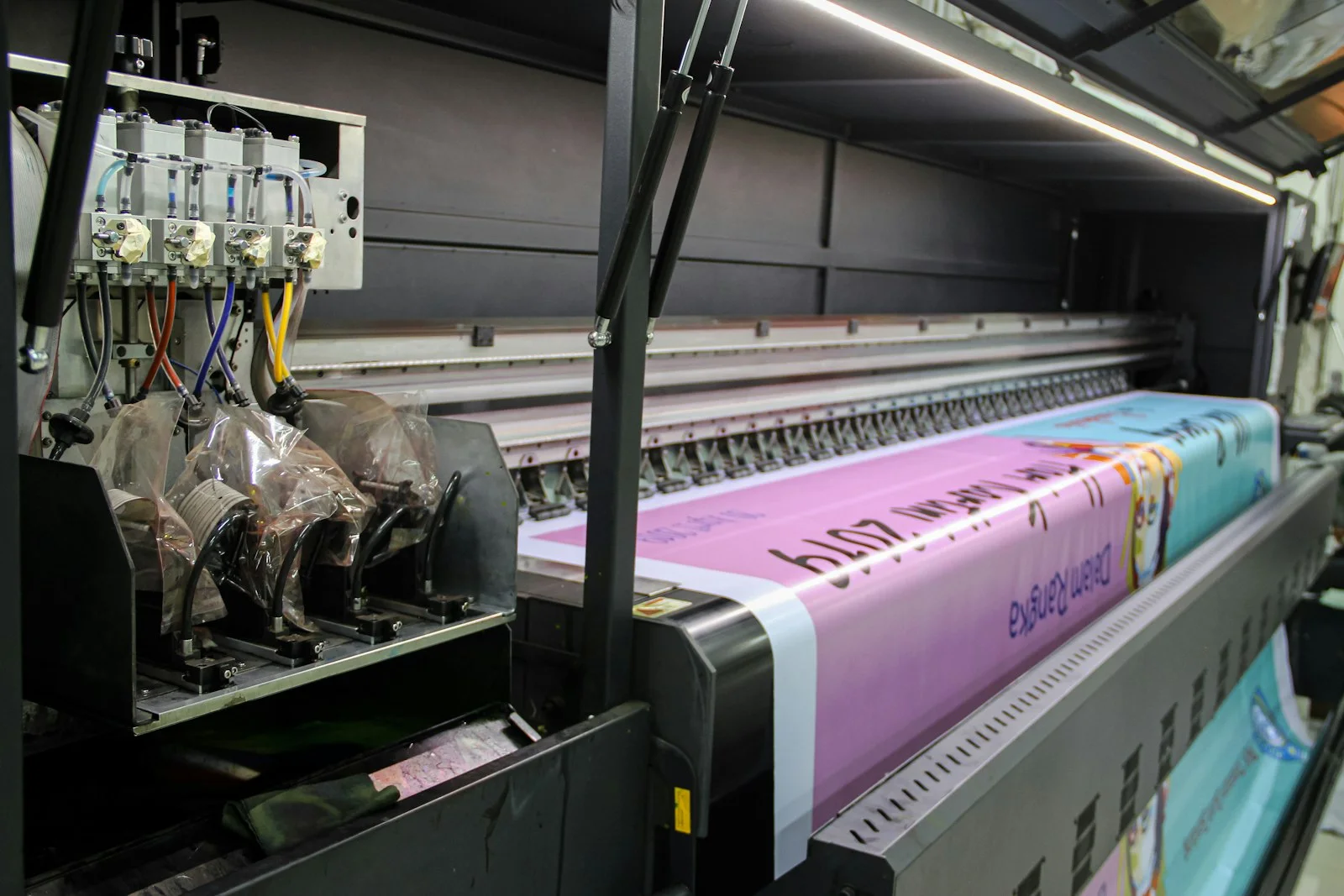 Large-format printer running a label job